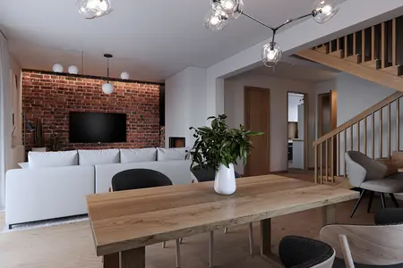 Wnętrze salonu w stylu eklektycznym z ceglaną ścianą, minimalistycznymi meblami, rośliną i drewnianymi akcentami.