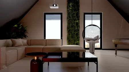 Wnętrze poddasza z roślinnym akcentem, nowoczesną sofą i industrialnym stołem.