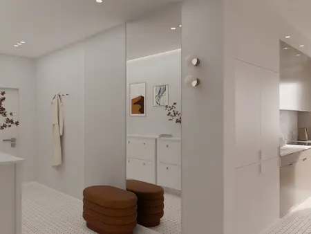Wnętrze w stylu minimalistycznym i vintage z białymi meblami oraz brązowymi dodatkami.