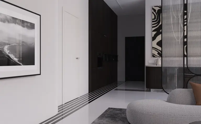 Wnętrze z elementami art deco i minimalistycznymi, z szarym dywanem i czarnymi meblami.