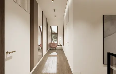 Przedpokój z minimalistycznym wystrojem, jasnymi ścianami i drewnianą podłogą.