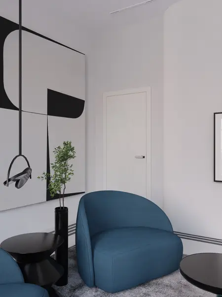 Nowoczesne wnętrze z fotelami w kolorze niebieskim, czarnym stolikiem i minimalistycznymi akcentami.