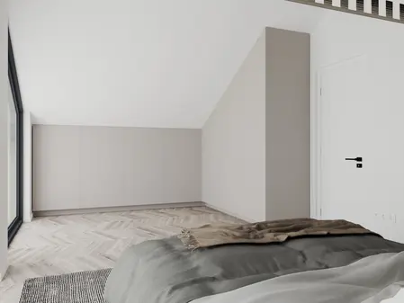 Wnętrze poddasza z minimalistycznym wystrojem, szarymi meblami i nowoczesnym stylem.