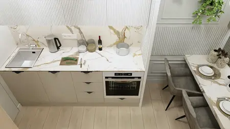 Wnętrze kuchni w stylu japandi z nowoczesnym blatem i drewnianą podłogą.