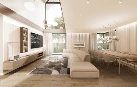 Elegancki salon z dużą, beżową sofą, nowoczesnym kominkiem oraz stołem jadalnianym z designerskimi lampami. Wnętrze o jasnych kolorach i panoramicznym oknie z widokiem na ogród.