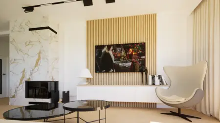 Wnętrze salonu z nowoczesnym kominkiem, telewizorem oraz designerskim fotelem.