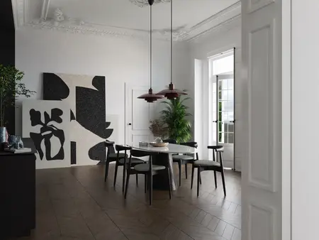 Wnętrze jadalni w stylu art deco z drewnianym stołem, czarnymi krzesłami i nowoczesną sztuką.