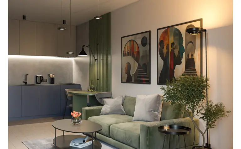 Wnętrze salonu w stylu industrialnym i minimalistycznym z zieloną sofą i nowoczesnymi obrazami.