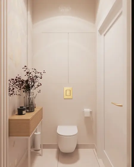Minimalistyczna toaleta z jasnymi ścianami i drewnianymi akcentami.