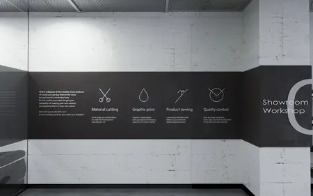 Wnętrze warsztatu z minimalistycznym i nowoczesnym designem, szare ściany, czarne elementy.