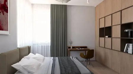 Eklektyczna sypialnia z szarymi ścianami, drewnianymi meblami i miękkim oświetleniem.