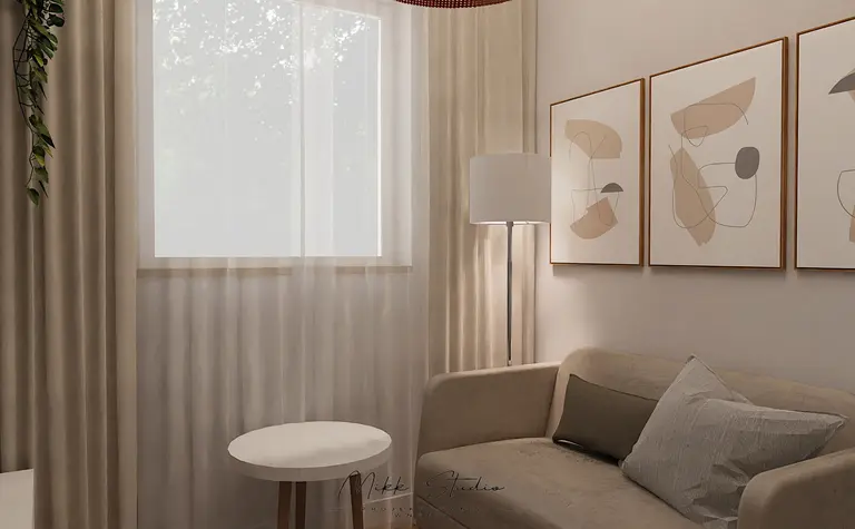 Współczesny salon z beżową sofą, lampą i obrazami.