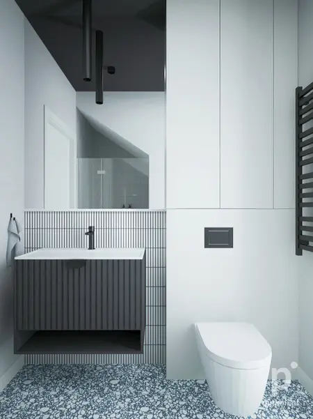 Nowoczesna łazienka z minimalistycznym designem, białą umywalką i szarym wykończeniem.