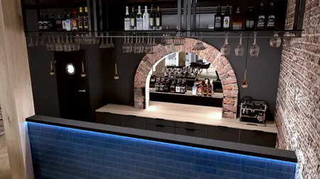 Wnętrze industrialnego baru z drewnianym blatem i ciemnymi elementami.