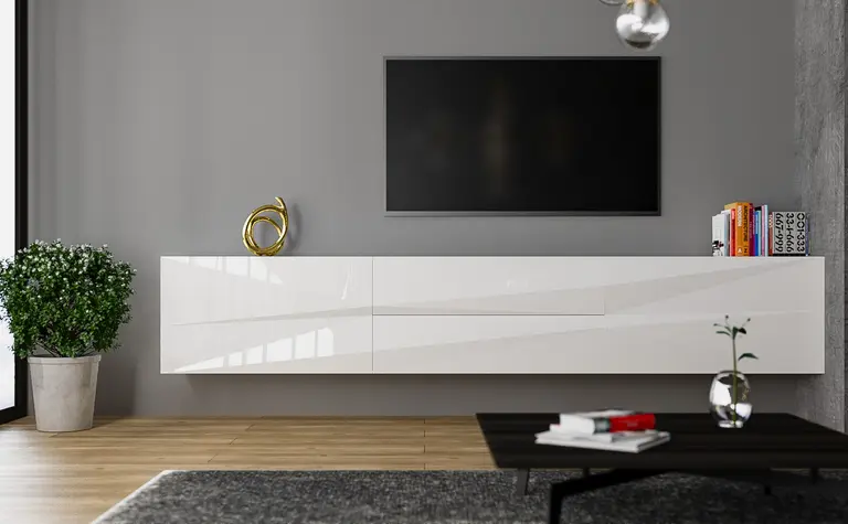 Nowoczesne wnętrze salonu z białą szafką, telewizorem i rośliną.