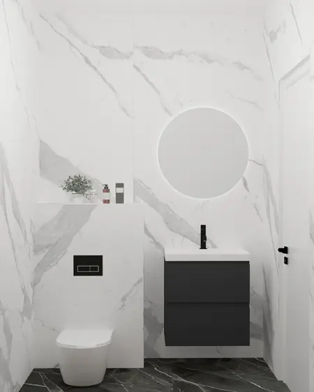 Nowoczesna łazienka z białymi płytkami, czarną umywalką i minimalistycznym designem.