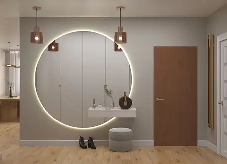 Przedpokój z okrągłym lustrem, drewnianymi meblami i stylowymi lampami, w aranżacji boho i japandi.