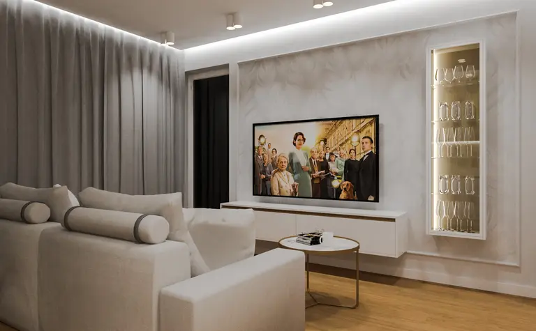 Wnętrze salonu z jasną sofą, telewizorem i eleganckimi detalami w stylu quiet luxury.