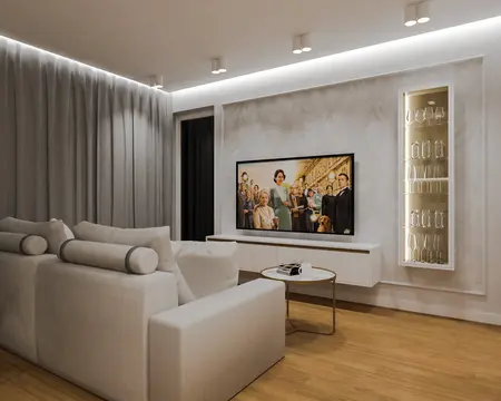 Wnętrze salonu z jasną sofą, telewizorem i eleganckimi detalami w stylu quiet luxury.