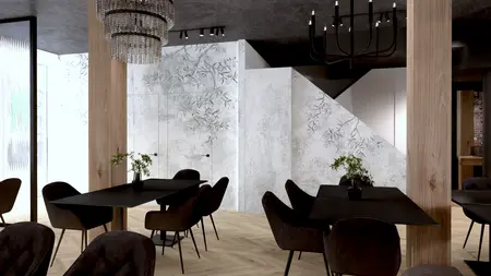 Wnętrze restauracji w stylu industrialnym z czarnymi stołami i drewnianymi akcentami.