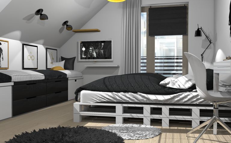 Wnętrze poddasza w stylu boho z czarnymi meblami i jasnymi detalami.