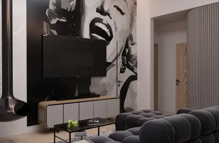 Wnętrze salonu w stylu eklektycznym i minimalistycznym z czarną sofą i muralem.