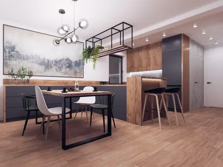 Nowoczesna kuchnia w stylu industrialnym z drewnianymi meblami i minimalistycznym oświetleniem.