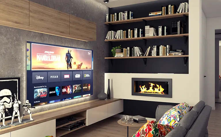 Wnętrze salonu z telewizorem, półkami na książki oraz kominkiem w stylu industrialnym i nowoczesnym.
