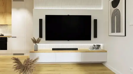 Wnętrze z telewizorem, drewnianą półką i roślinnością, styl industrialny i minimalistyczny.