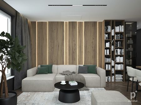 Wnętrze nowoczesnego salonu z minimalistycznym designem, szarym narożnikiem i drewnianymi elementami.