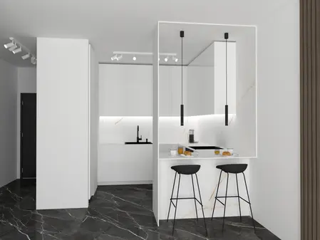 Minimalistyczna kuchnia z białymi meblami i czarnym blatem.