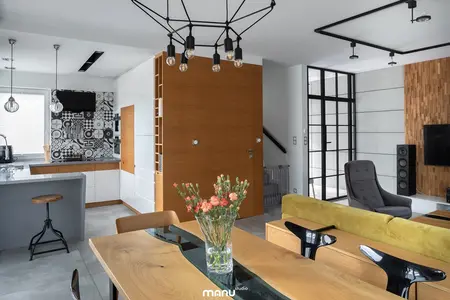 Wnętrze kuchni z elementami industrialnymi i skandynawskimi, minimalistyczne meble.
