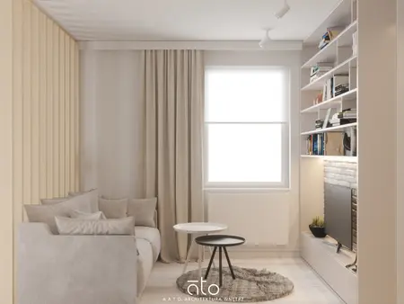 Wnętrze nowoczesnego salonu ze skandynawskimi akcentami, beżowa sofa i biała biblioteczka.