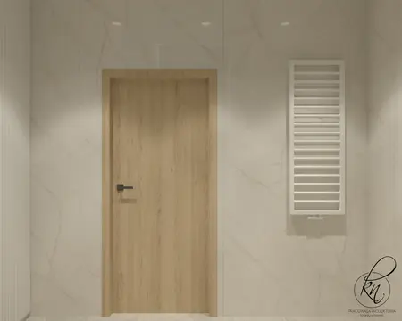 Minimalistyczny hol z drewnianymi drzwiami i białymi ścianami.