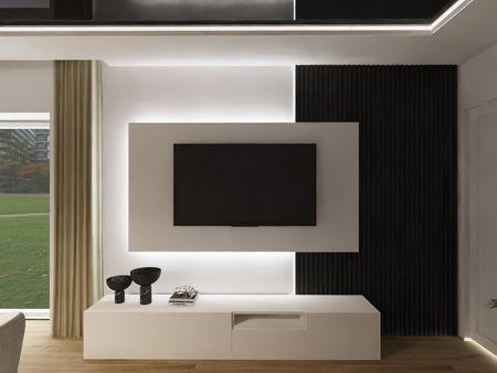 Nowoczesne wnętrze salonu z minimalistycznym designem, białymi meblami i czarnymi akcentami.