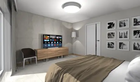 Wnętrze sypialni z telewizorem, drewnianą komodą i minimalistycznymi akcentami.