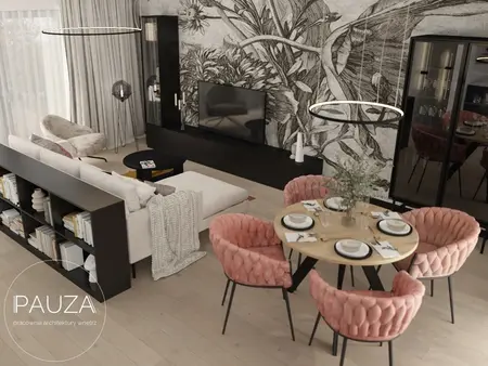 Nowoczesny salon z różowymi krzesłami i dużą sofą, telewizor na ścianie.
