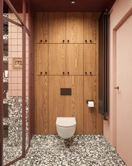 Wnętrze toalety w stylu art deco i vintage z drewnem i różowymi kafelkami.