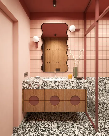 Wnętrze łazienki w stylu art deco z marmurowym blatem i drewnianymi meblami.