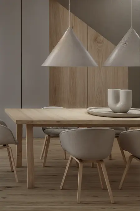 Wnętrze jadalni z drewnianym stołem, minimalistycznymi lampami i eklektycznymi akcentami.