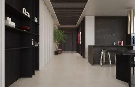 Wnętrze nowoczesnej kuchni z minimalistycznym designem, czarnymi meblami i jasnym blatem.