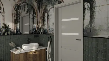 Wnętrze łazienki z zielonymi płytkami, białą umywalką i art deco muralem.