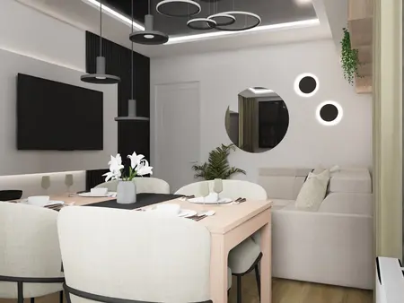 Nowoczesna jadalnia z minimalistycznym stołem, jasnymi krzesłami i rośliną.