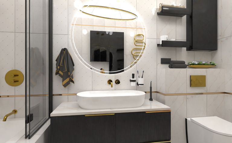 Nowoczesna łazienka z elementami glamour i industrialnymi, czarna szafka, okrągłe lustro.