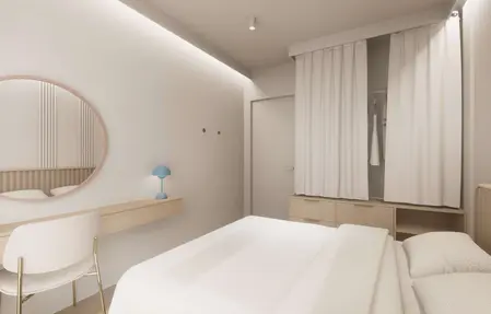 Wnętrze sypialni w stylu japandi, minimalistycznym i nowoczesnym z białymi meblami.