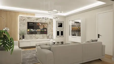 Wnętrze salonu z jasnymi meblami, telewizorem i dekoracjami glamour.