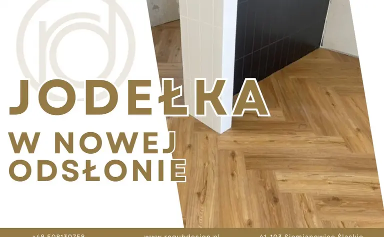 Nowoczesne wnętrze z drewnianą podłogą i czarną ścianą, styl minimalistyczny.