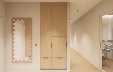 Minimalistyczny przedpokój w stylu japandi z drewnianą szafą i lustrem.