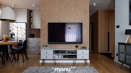 Wnętrze z telewizorem, drewnianą ścianą i nowoczesnymi meblami