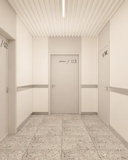 Korytarz w minimalistycznym stylu z szarymi ścianami i nowoczesnymi drzwiami.